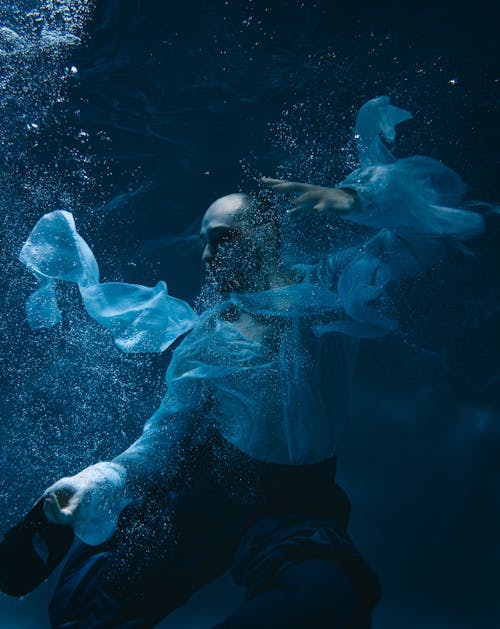 Man in Shirt Posing Underwater 