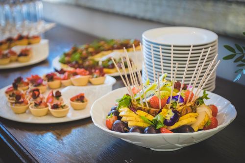 Free A beautifully arranged platter of fruit and desserts on a dining table, perfect for events. Stock Photo