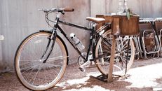 Black Bicycle Parked on Dirt Road