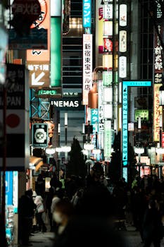 Explore the bustling nightlife of Tokyo's Shinjuku with vibrant lights and city streets.