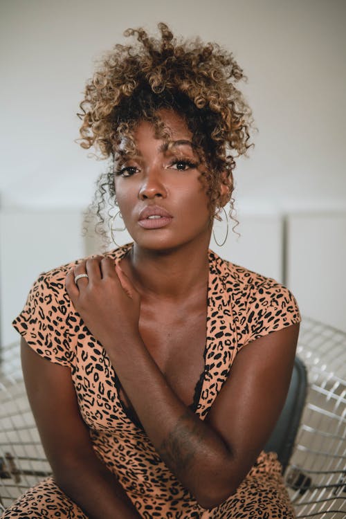 Woman in Brown and Black Leopard Print Shirt