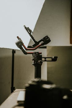 Gimbal equipment on a table in an indoor setting, perfect for videography.