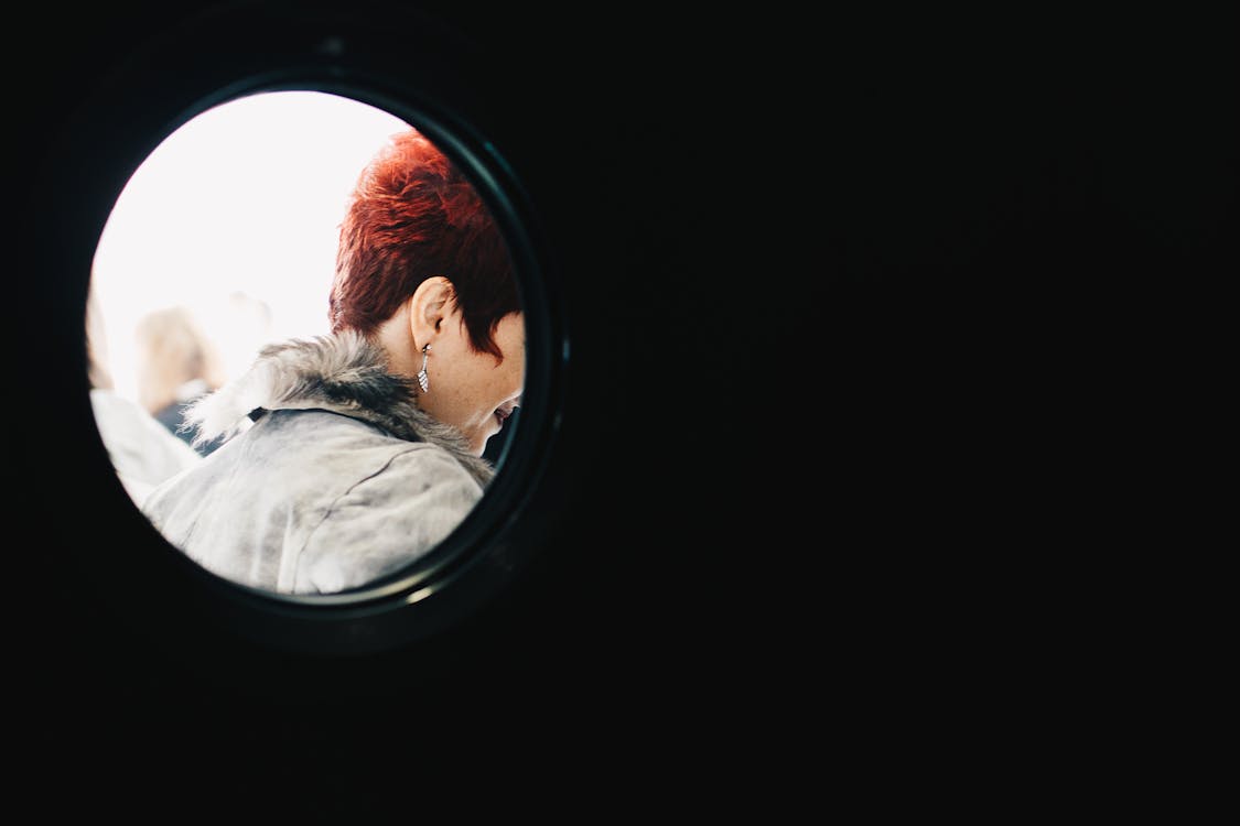 Person With Red Hair Wearing Gray Parka