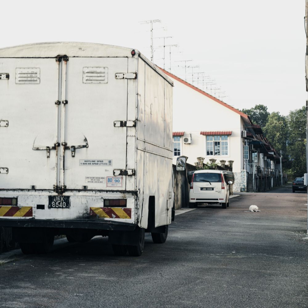 Bloxham — house clearance team loading furniture into a van
