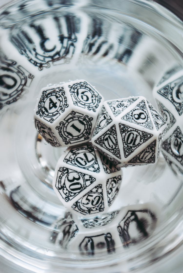 A Close-Up Shot Of White Dungeons And Dragons Dice