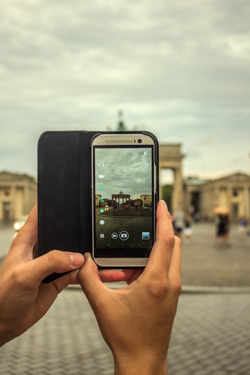 Free Person Taking Picture Using Gray Smartphone Stock Photo