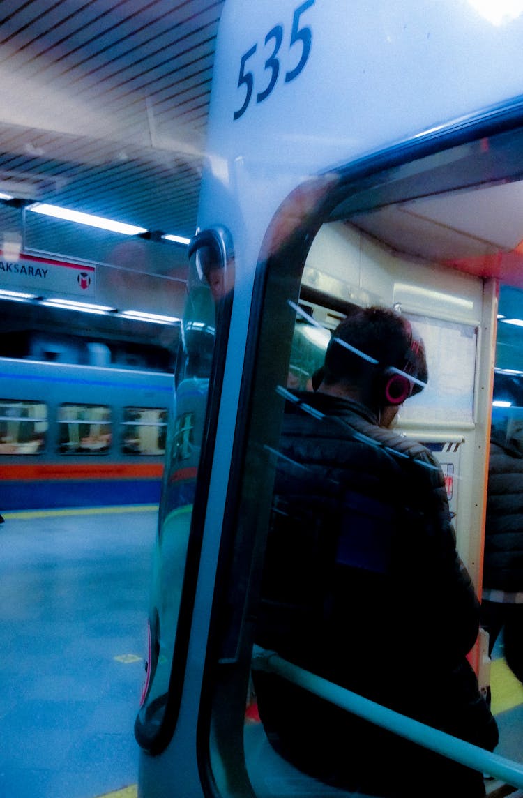 Man Behind Metro Train Window