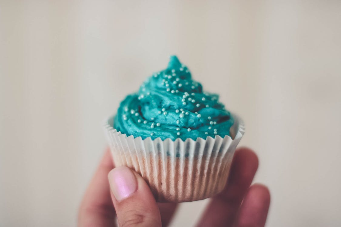 Free Cupcake With Teal Icing and Sprinkles Stock Photo