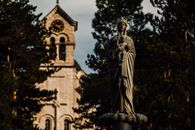 Statue of Man Near Building