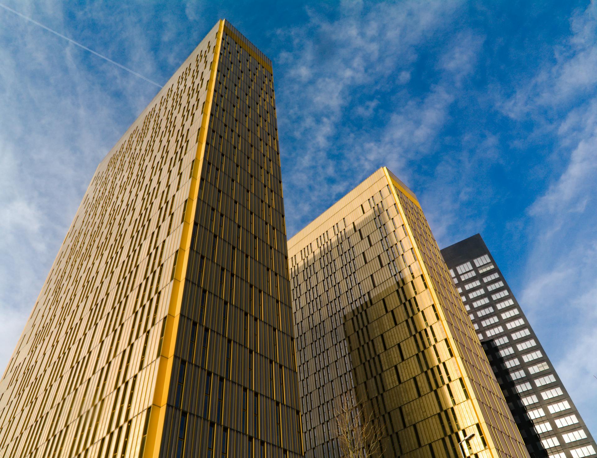 Captivating view of Luxembourg modern skyscrapers reaching into a clear blue sky, showcasing architectural elegance.