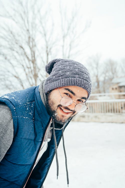 Smiling Man Wearing Metal Framed Eyeglasses 