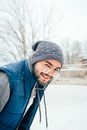 Man in Gray Knit Cap and Blue Jacket