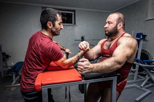Arm Wrestling Between Men Facing Each Other