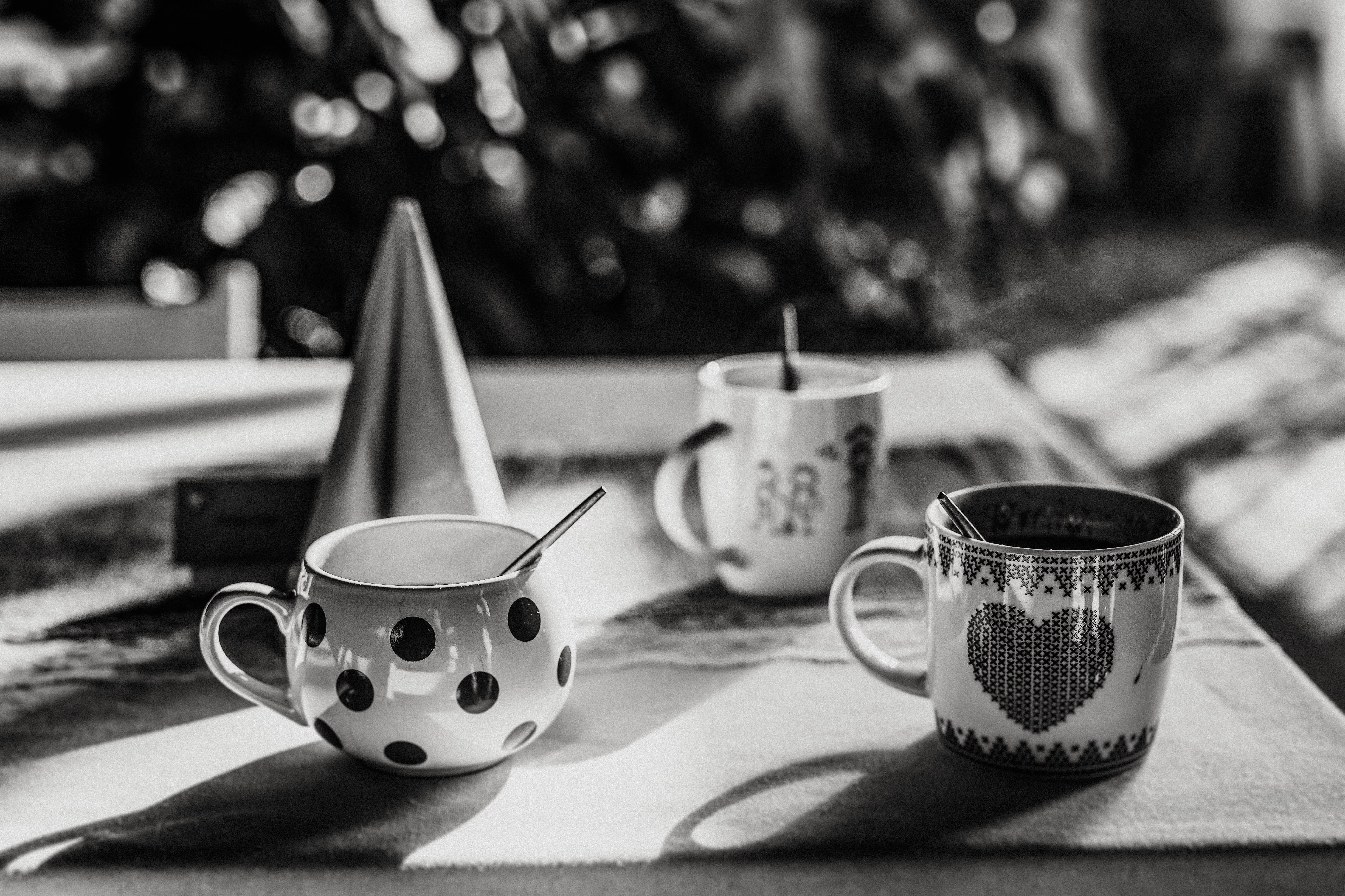 White and Black Ceramic Mug With Stainless Steel Spoon  Free Stock Photo