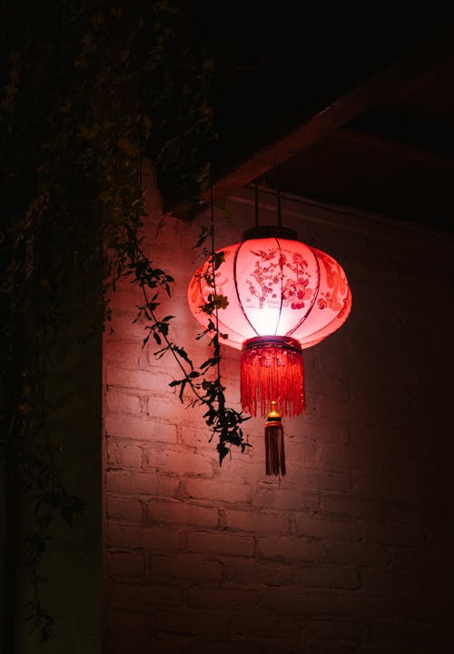 Chinese Lantern Hanging Beside the Brick Wall