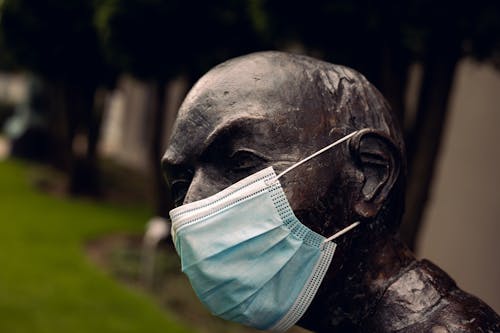 A Sculpture of a Man in Face Mask