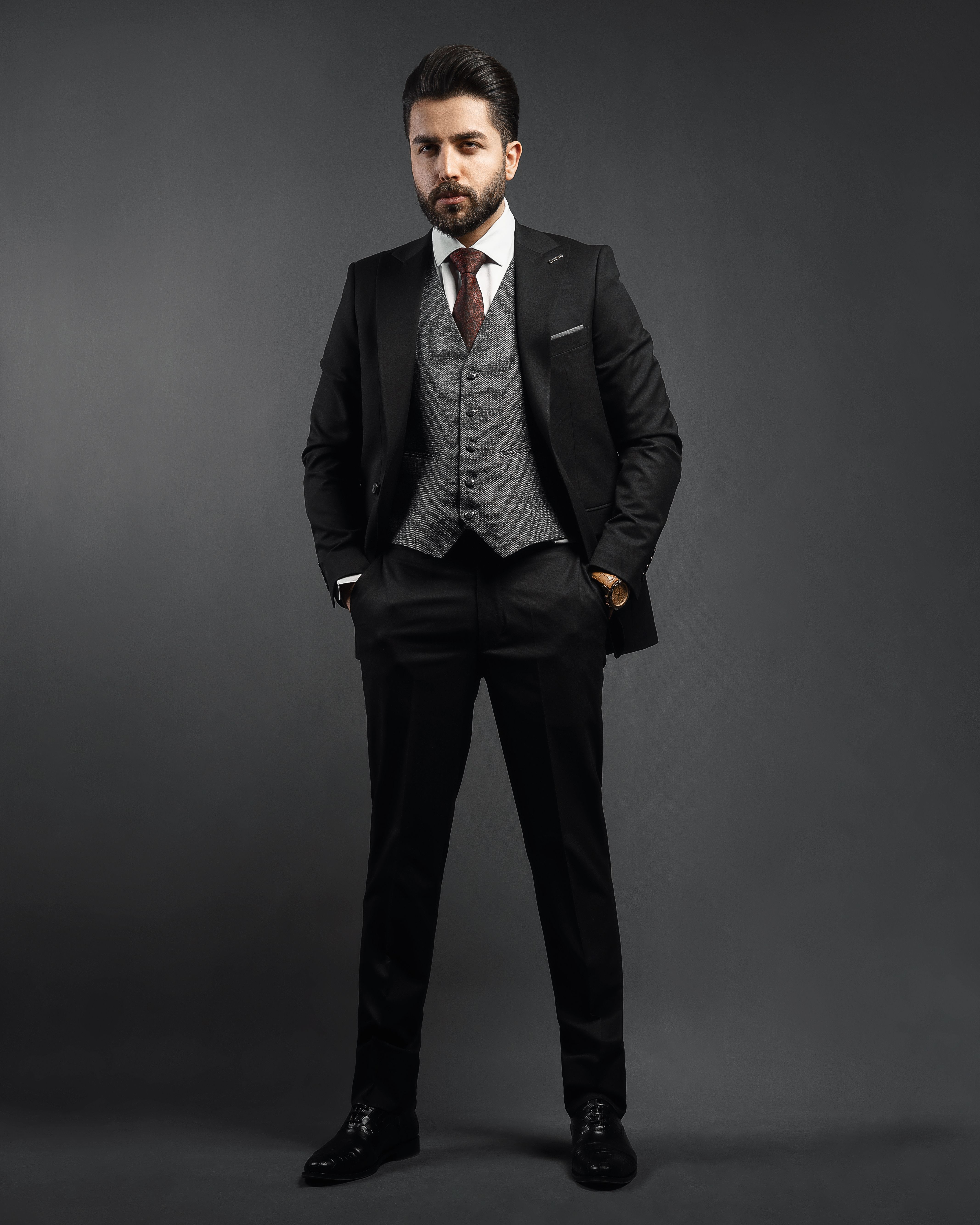 A Man in Black Suit Standing while Posing · Free Stock Photo