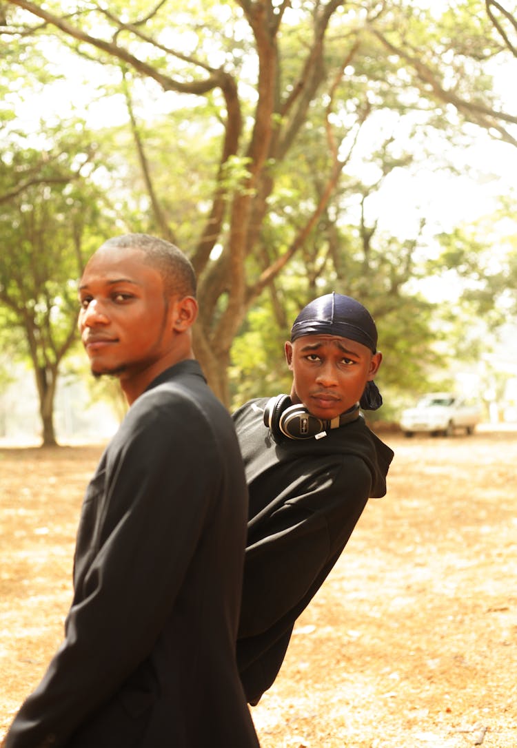 Photograph Of Boys In Black Shirts