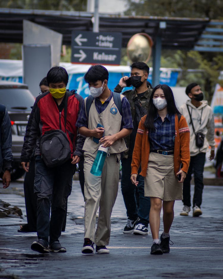 A Group Of Students Walking Together