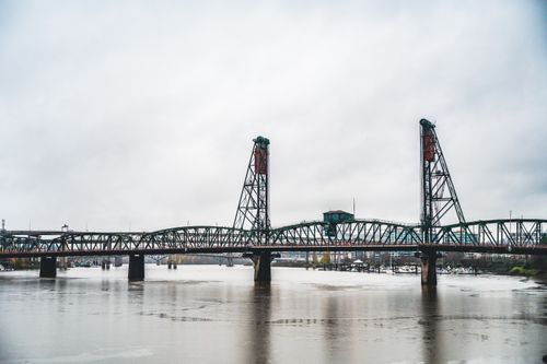 Free Scenic view of Hawthorne Bridge spanning the Willamette River on a cloudy day. Stock Photo