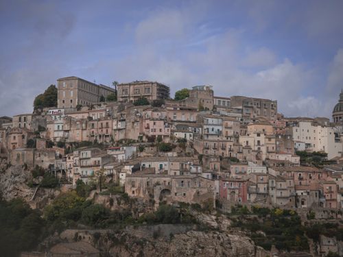 Free Charming view of a historic hilltop town in Italy, showcasing ancient stone buildings and scenic architecture. Stock Photo