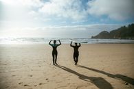 2 Women Holding Hands on Beach