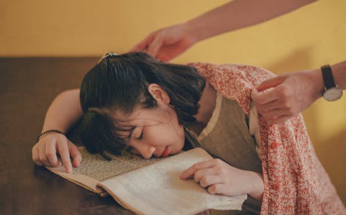 Person Covering Woman With Blanket