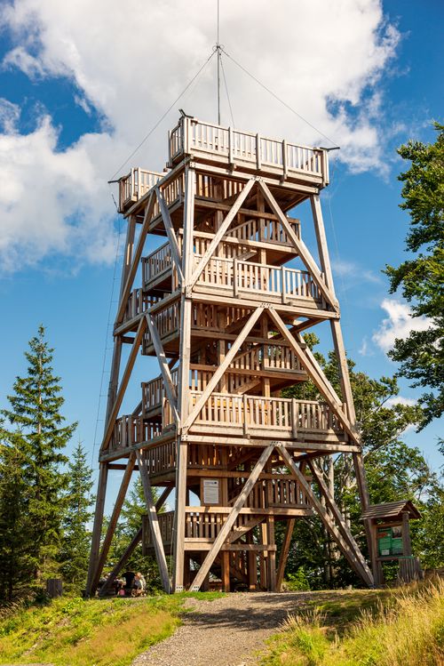 Free A stunning wooden observation tower set against a clear blue sky, surrounded by nature. Stock Photo