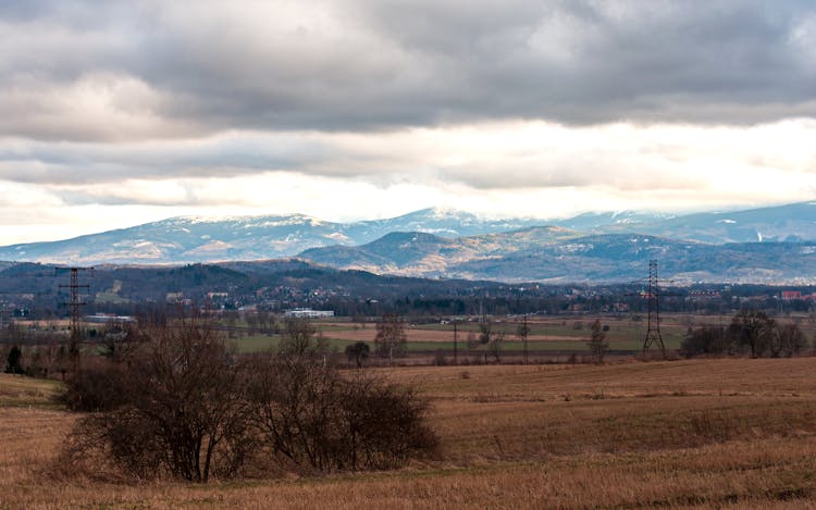 Clouds Over Plains, Hills And Mountains