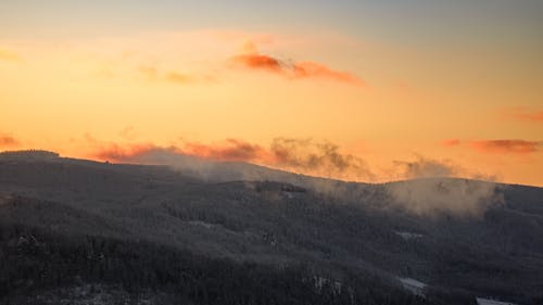 Free Green Mountain Under Orange Clouds Stock Photo