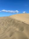 People Walking on Desert Under Blue Sky