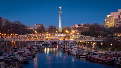 Bridge and Moored Motorboats in Paris in Evening