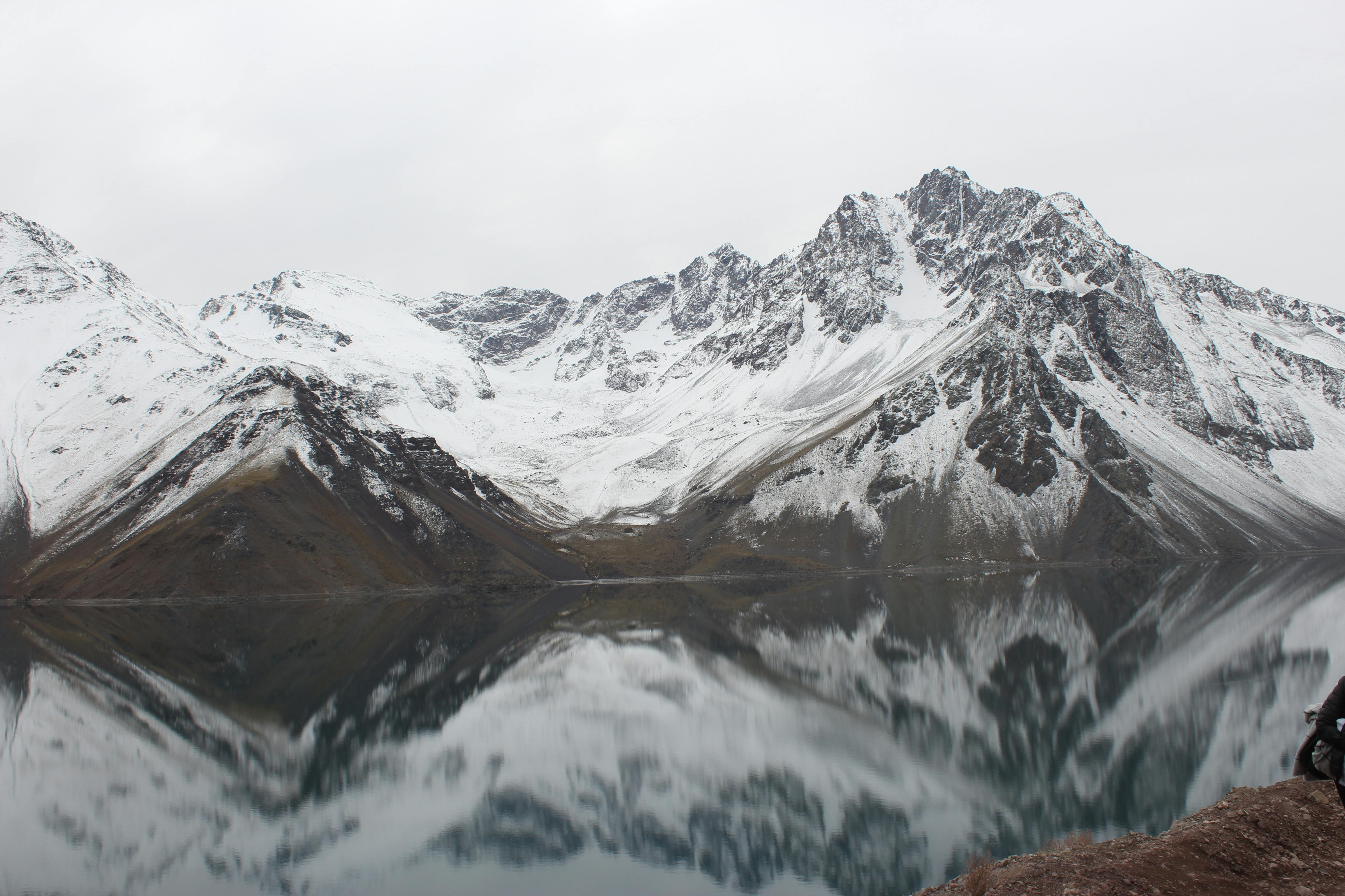 Prescription Goggle Inserts - Breathtaking snow-covered peaks reflected in a tranquil mountain lake during winter.