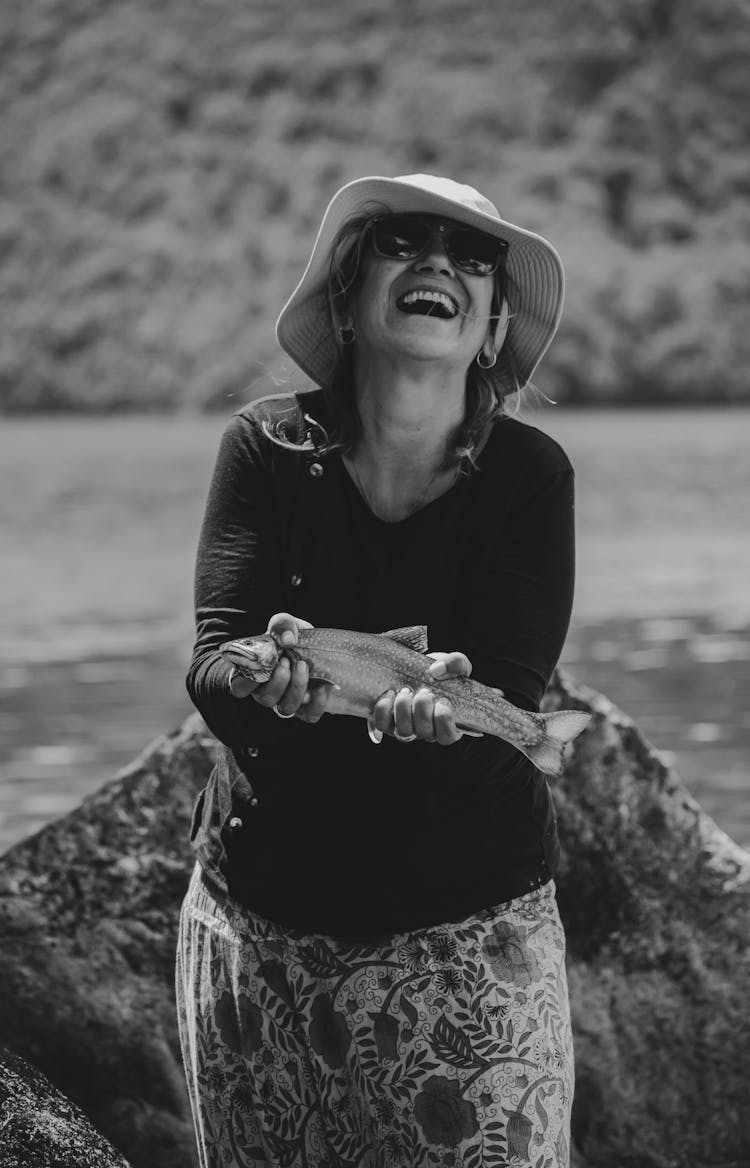 Laughing Woman Holding A Fish 