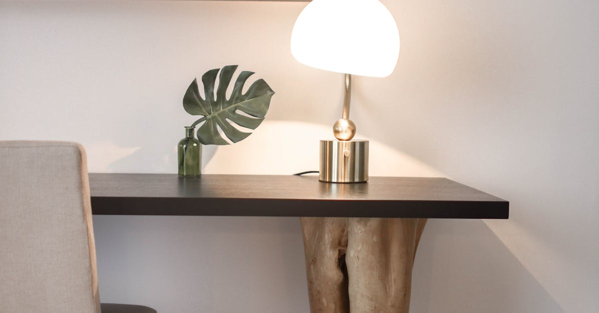 Photo by Element5 Digital Elegantly designed modern workspace featuring a unique wood table, chair, and lamp.