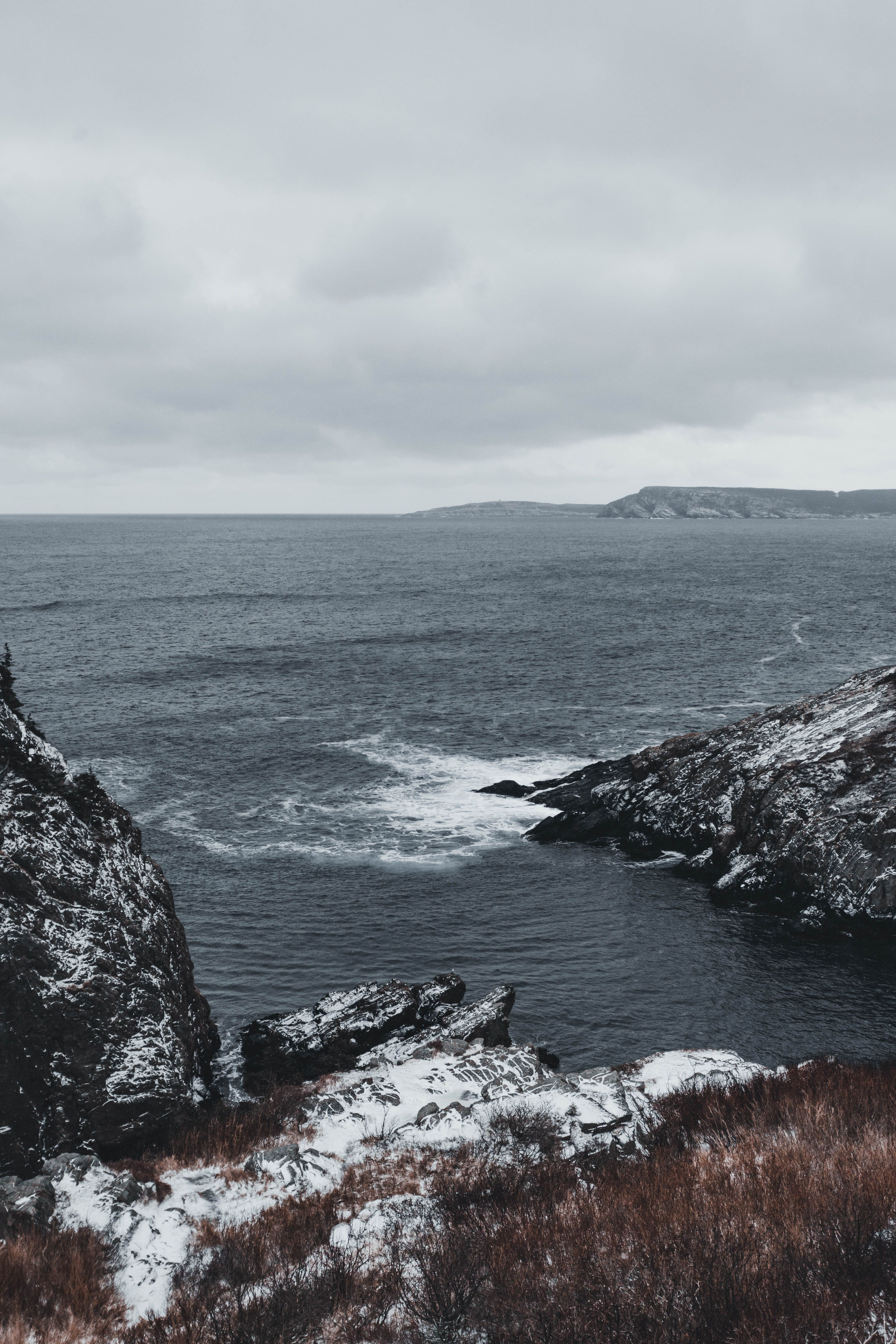 Rocky Shore Under Cloudy Sky · Free Stock Photo