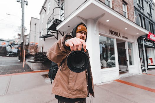 A street photographer with a wide-angle lens in an urban environment, emphasizing modern photography.