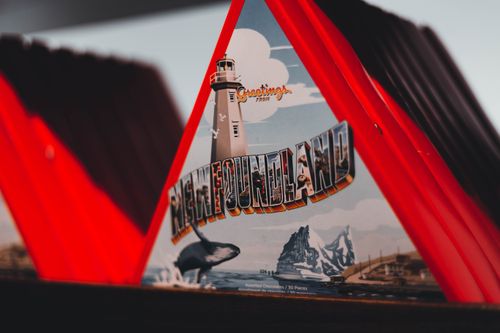 Free Close-up view of a Newfoundland-themed chocolate box with lighthouse design. Stock Photo