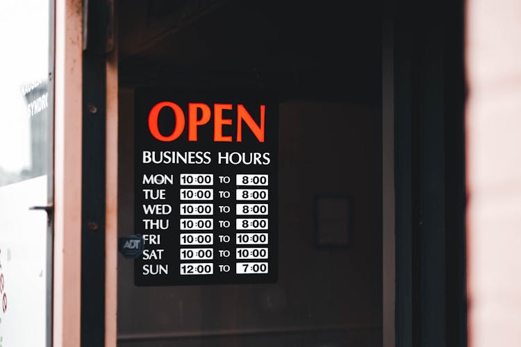 Photo Of Business Hours Signage