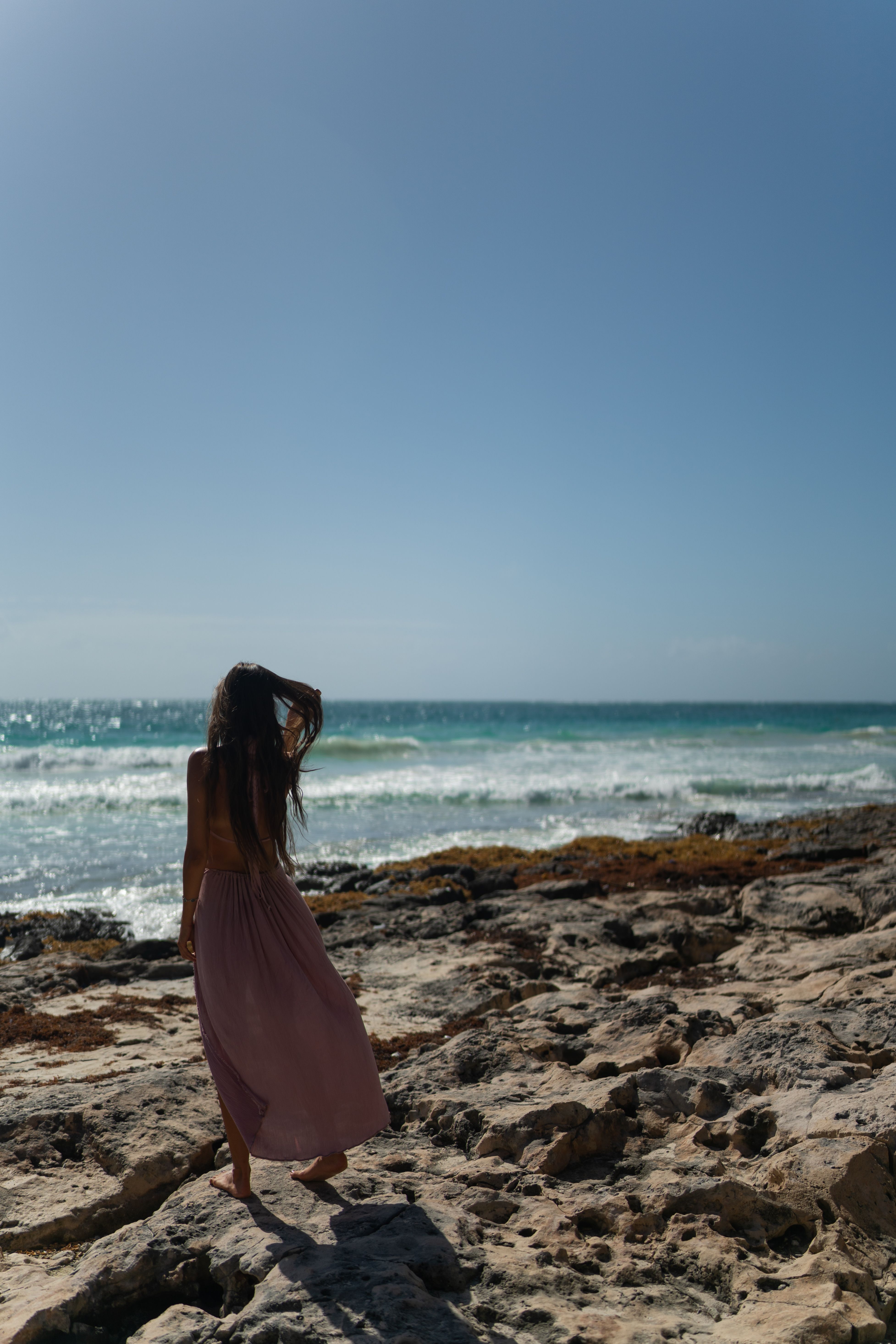 Back View of a Woman Near the Sea · Free Stock Photo