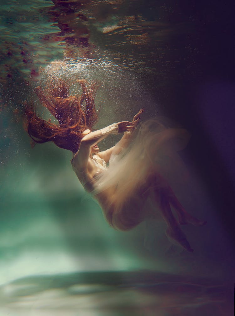 Woman Posing In Dress Underwater 