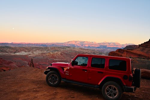 Jeep Car on a Desert at Sunset 