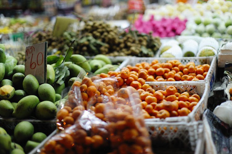 Orange And Green Fruits In The Market