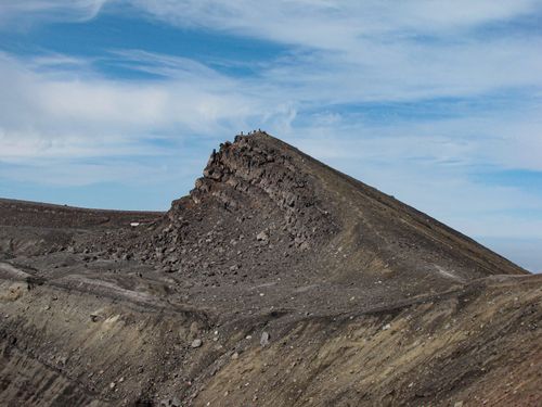 Free Dramatic landscape of a rocky volcanic ridge under a blue sky in Kamchatka, Russia. Stock Photo