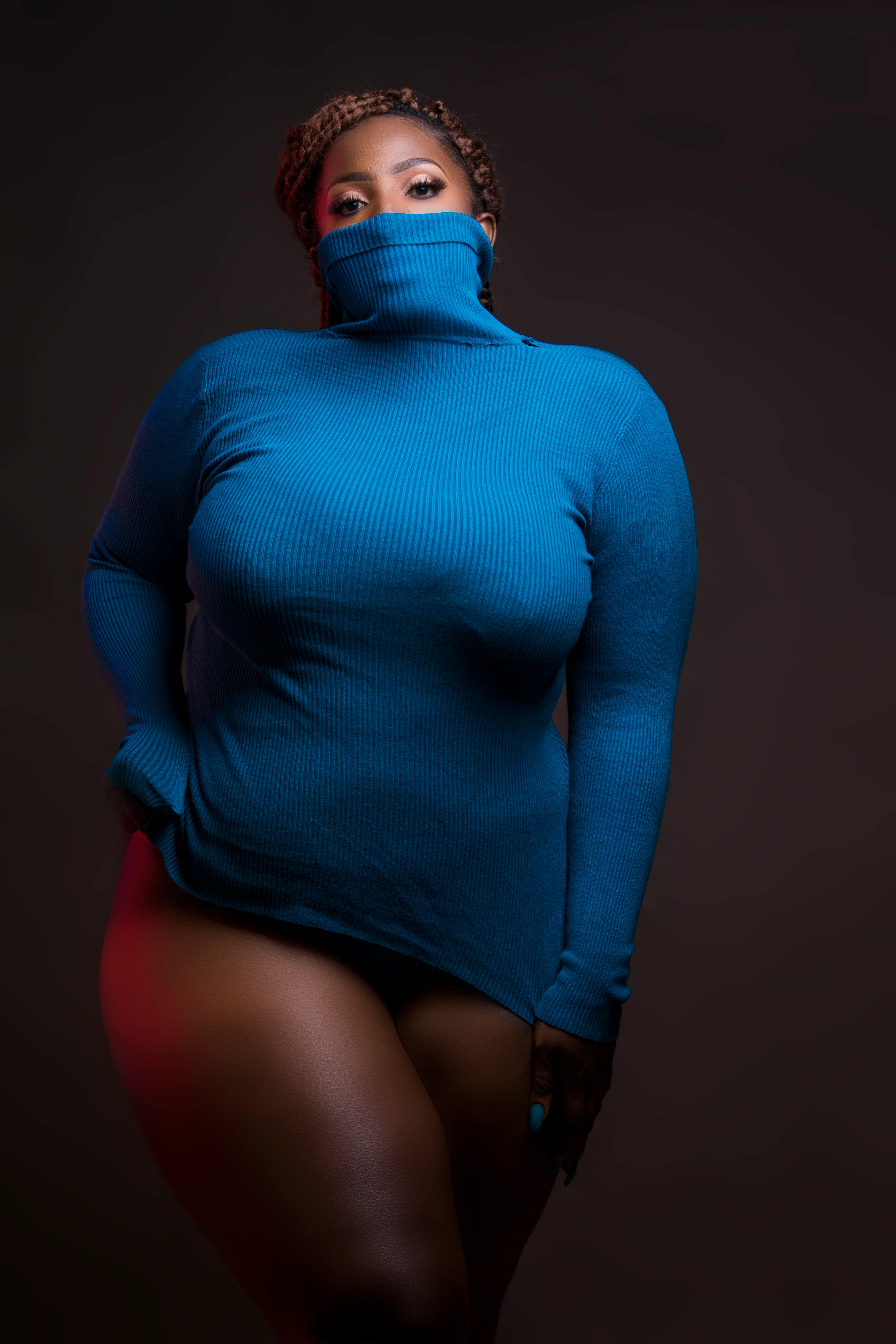 Woman in Blue Turtleneck Sweatshirt