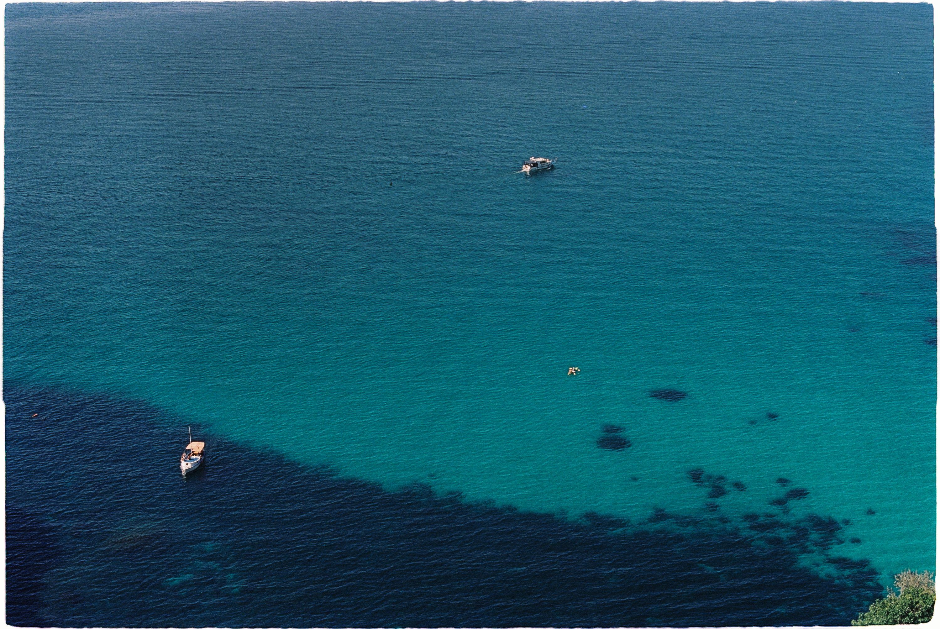 Aerial Photo of Boats on a Blue Body of Water · Free Stock Photo