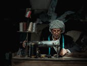 A Man using Sewing Machine