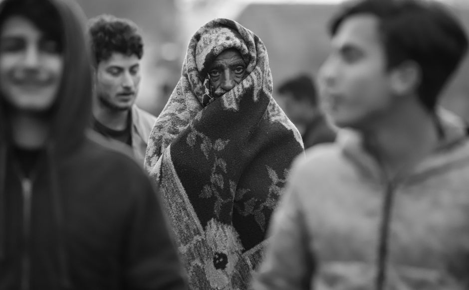 A captivating black and white street scene featuring a group of people in Iraq, highlighting cultural diversity.