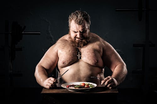 Free Topless Man Holding White Ceramic Plate With Food Stock Photo