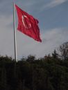 Red and White Flag on Pole